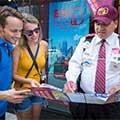 Couple talking to Big Bus Tours New York staff member